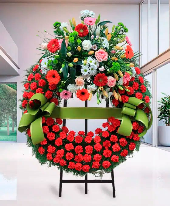 Corona Funeraria de claveles rojos para Tanatori Roses